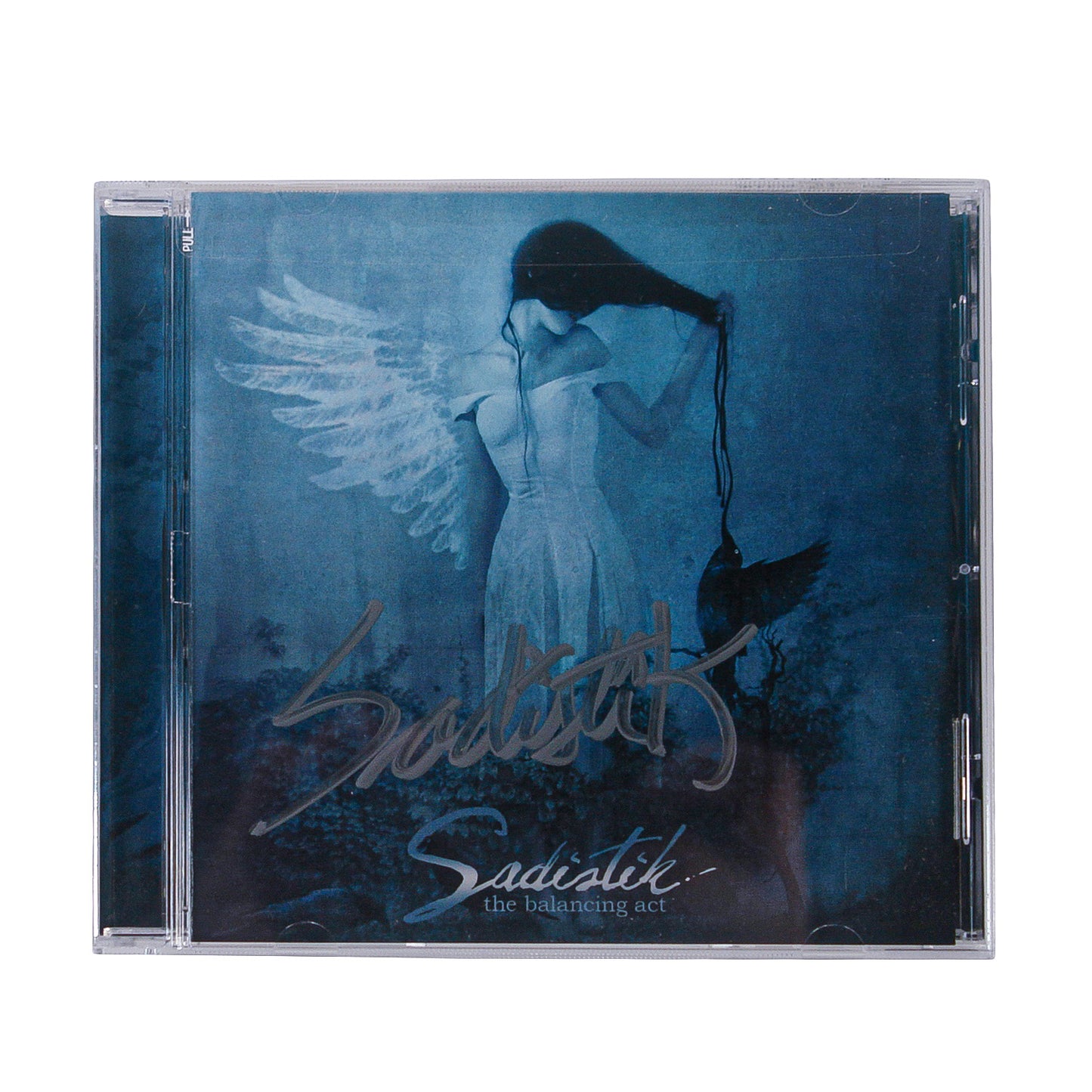 A blue-themed CD cover features a woman with angel wings lifting a black mask from her head. "Sadistik - The Balancing Act" is handwritten in silver and white on the front of this signed Sadistik CD.